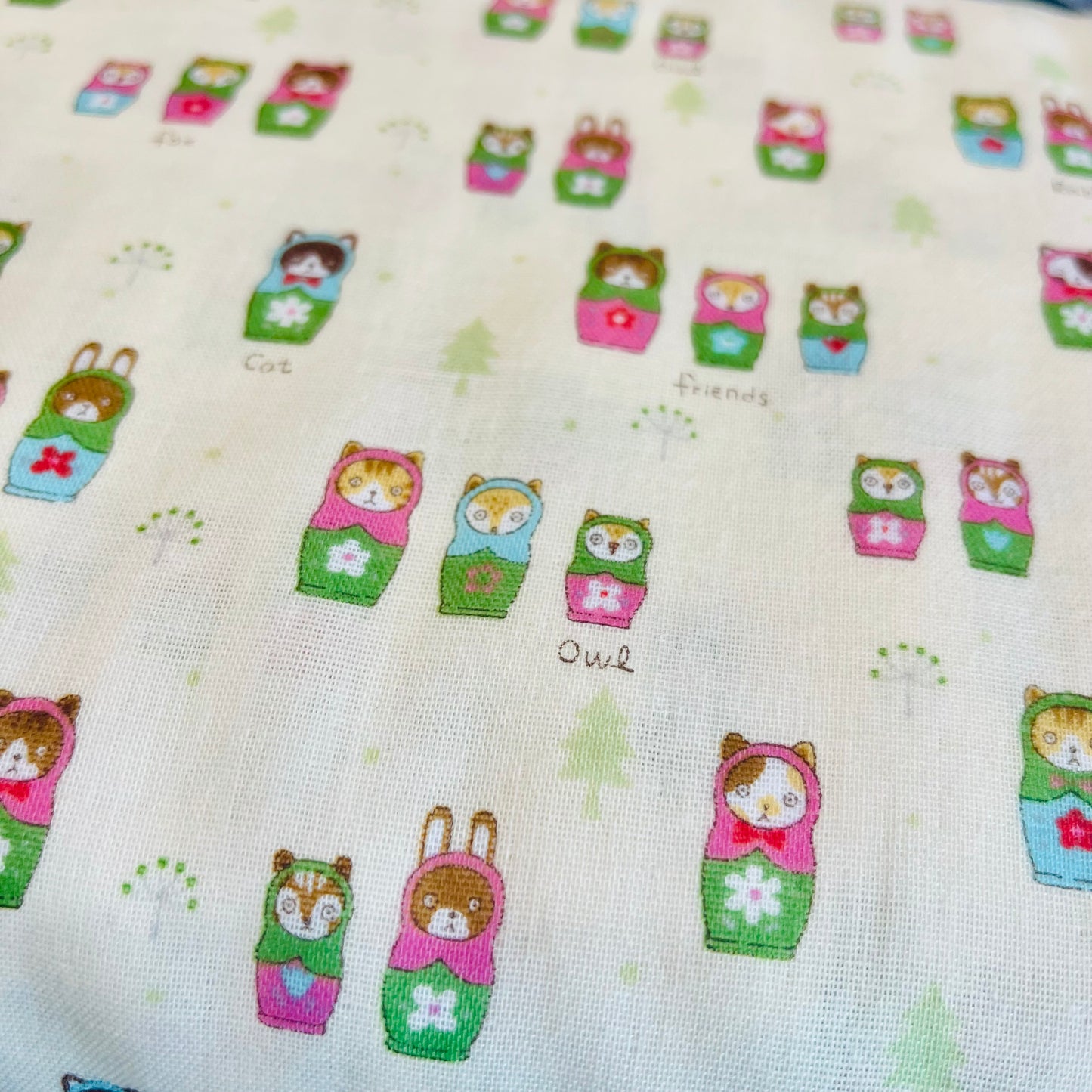 Matryoshka Nesting Animals  on Off White with Pink and Green on Double Gauze from Kokka